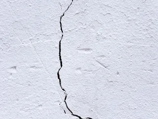Photograph: a crack running down a painted wall