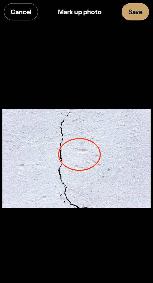 HOME's photo markup screen with a red circle drawn around a crack in a wall